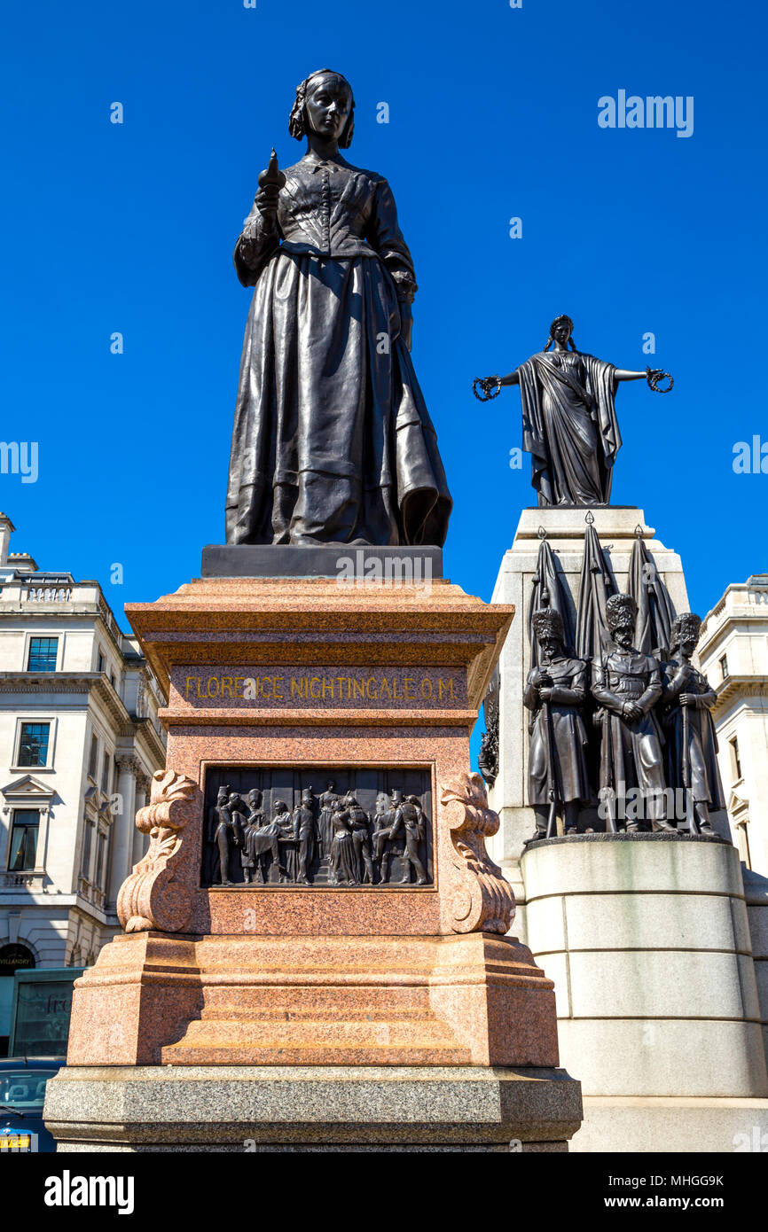 Statue of Florence Nightingale and the Guards' Memorial in Waterloo Place, London, UK Stock Photo
