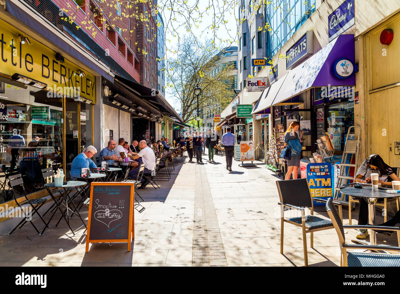 Pedestrian street with al fresco restaurants and cafes in the summer, Lansdowne Row, London, UK Stock Photo