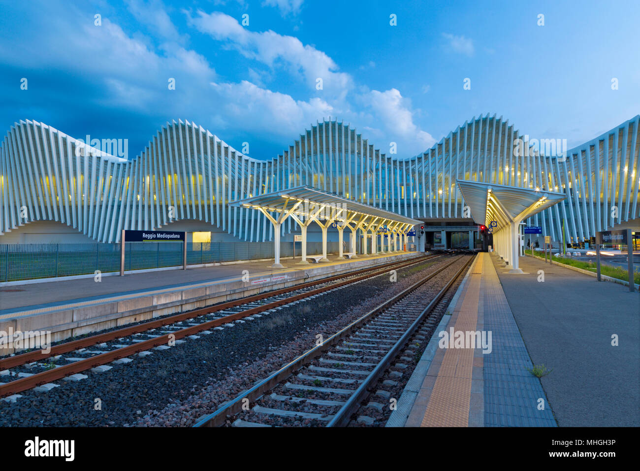 Reggio Emilia - The Reggio Emilia AV Mediopadana railway station at dusk by architect Santiago Calatrava. Stock Photo