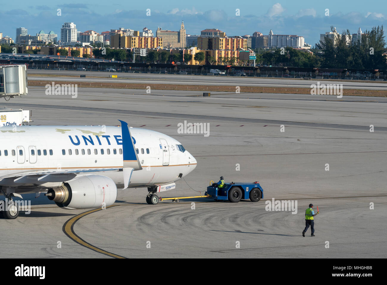 Towing a United Airlines jet on the taxiway at Miami International