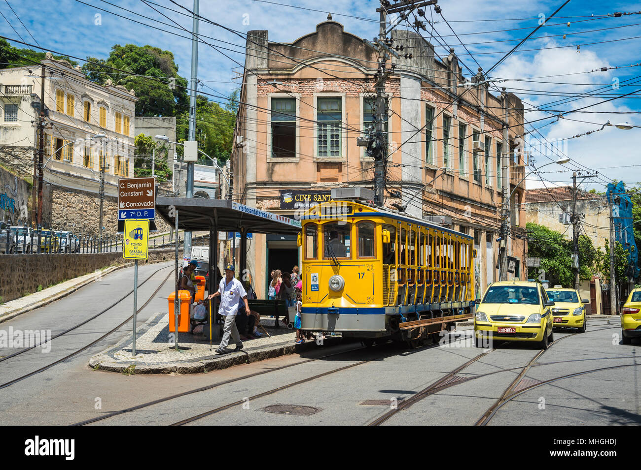 RIO DE JANEIRO - JANUARY 31, 2017: Passengers wait to board a traditional street car in the historic Santa Teresa neighborhood. Stock Photo