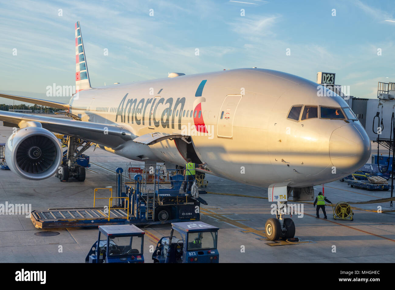 Ground crew off loading cargo from an American Airlines jet at Miami International Airport in Miami, Florida. Stock Photo