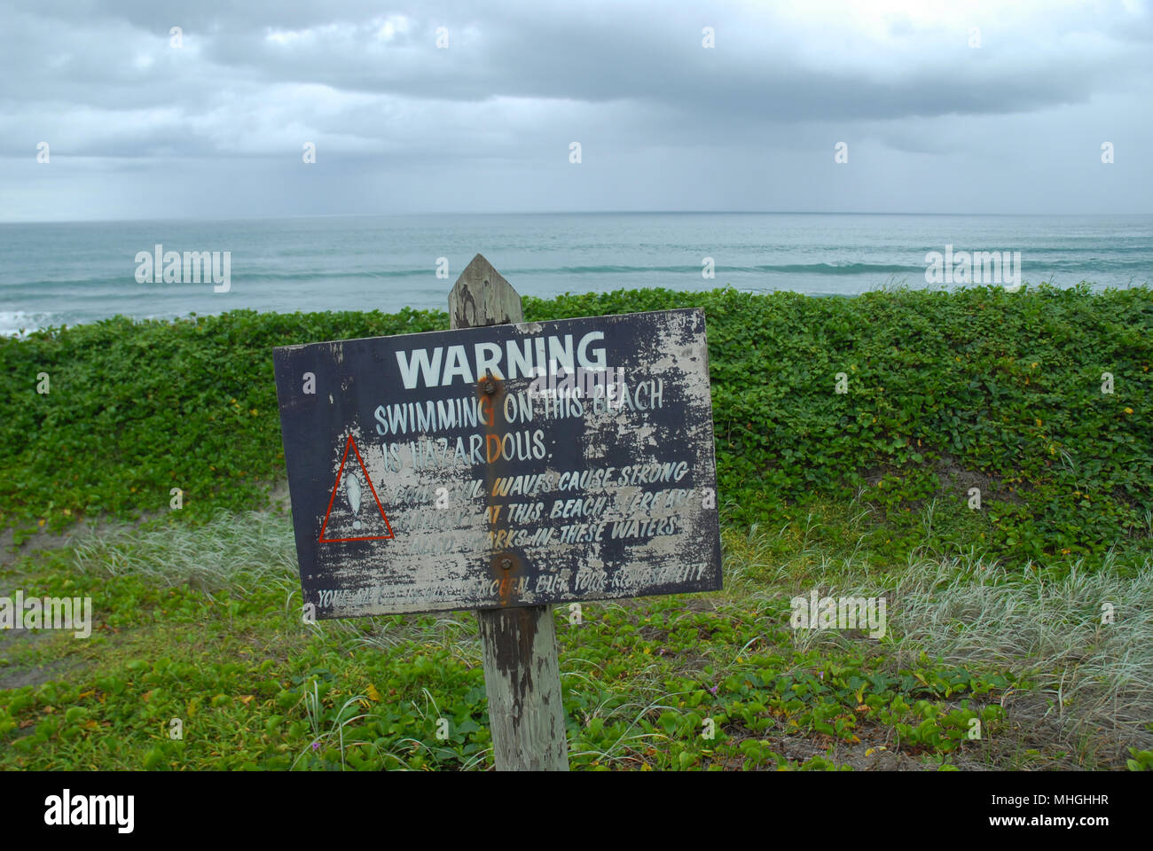 Warning Sign Swimming on this beach is hazardous, Sigatoka Sand Dunes National Park. Fiji. Stock Photo