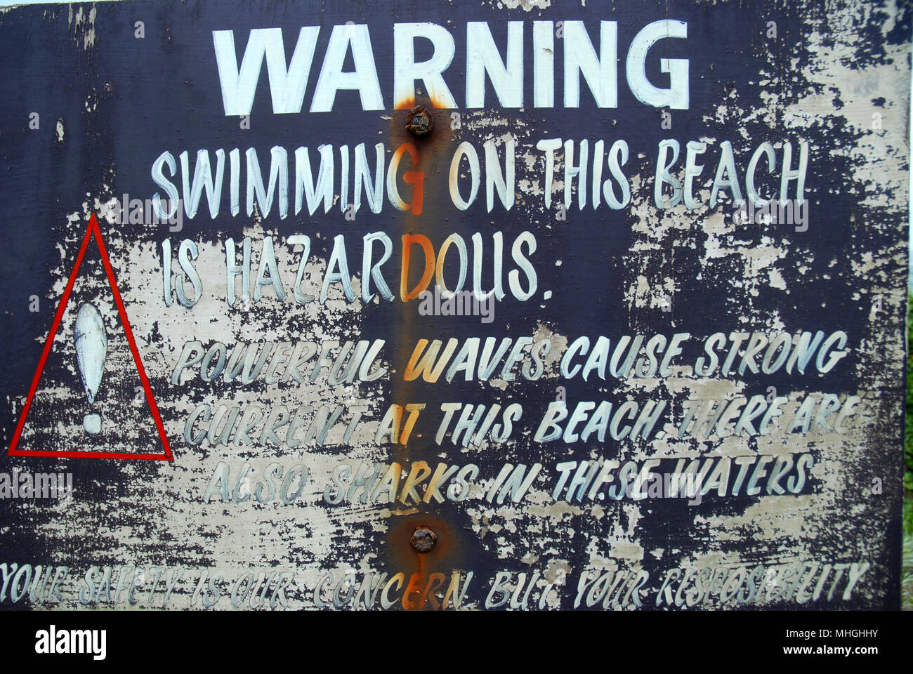 Warning Sign Swimming on this beach is hazardous, Sigatoka Sand Dunes National Park. Fiji. Stock Photo