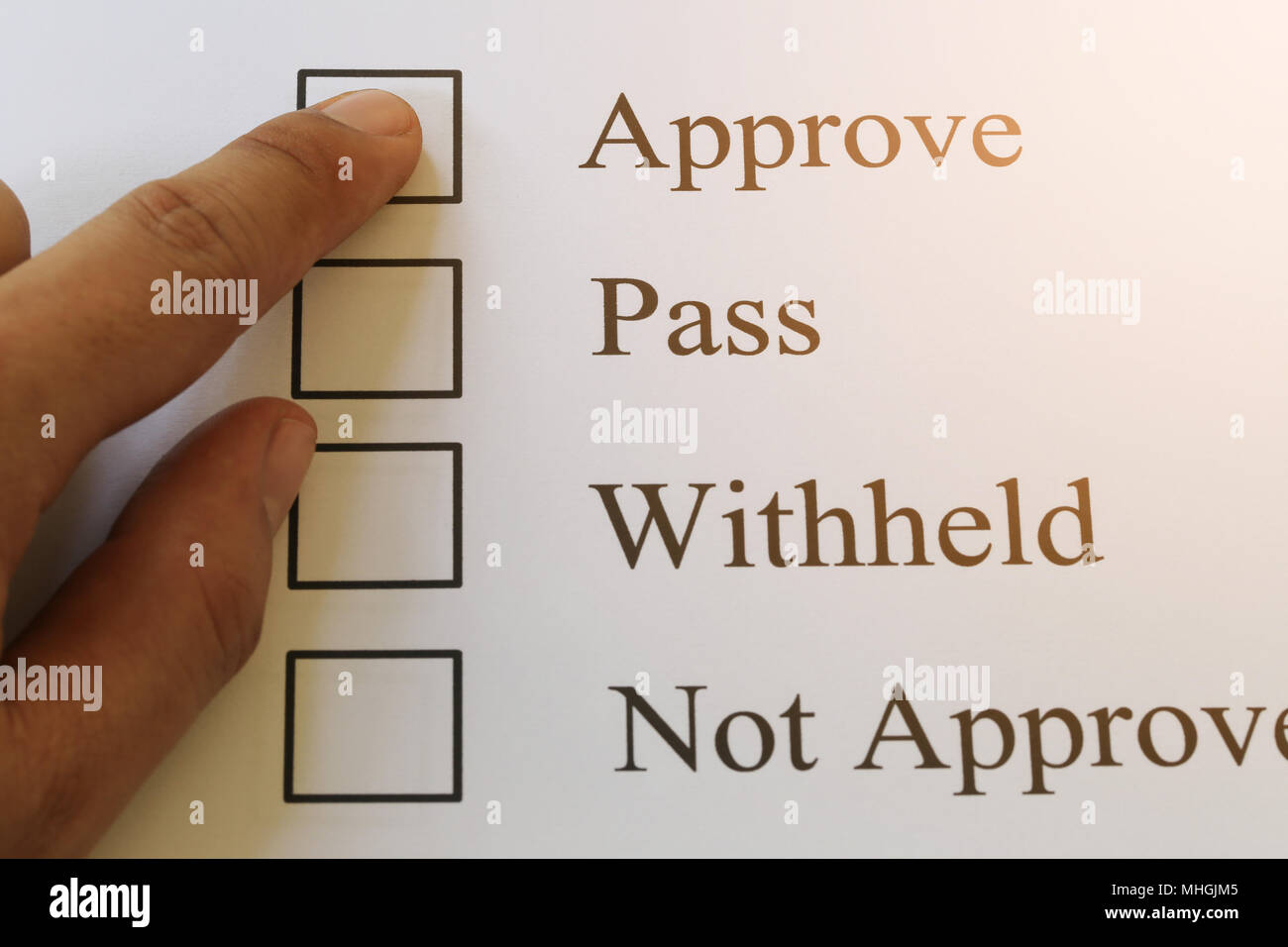 Businessman's fingers pointing at the check box and have approve text for design in presentation your work. Stock Photo