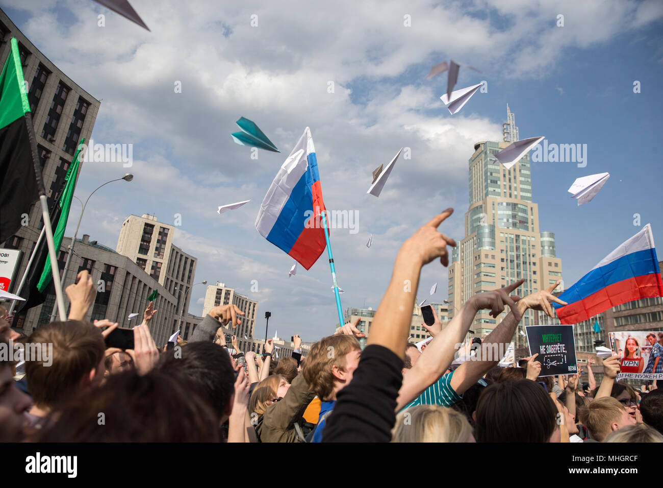 Moscow, Russia. 30th April, 2018. People throw paper planes as they take part in a rally for 'free Internet' and in support of the Telegram Messenger in Akademika Sakharova Avenue. On April 13, 2018, Moscow's Tagansky District Court ruled to block Telegram in Russia.  Credit: Victor Vytolskiy/Alamy Live News Stock Photo