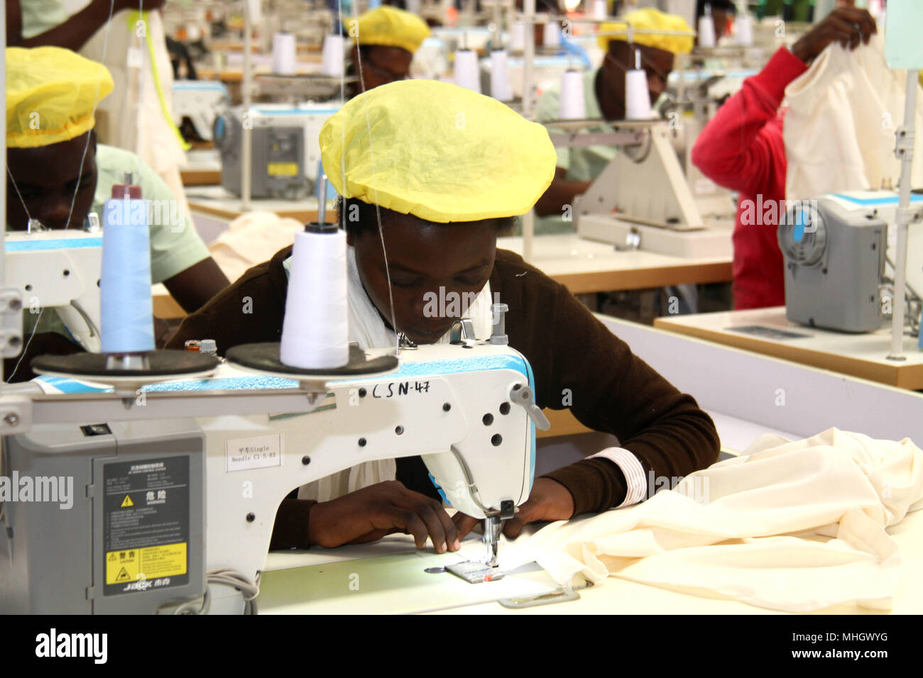 Kigali. 30th Apr, 2018. Rwandan workers operate sewing machine at a