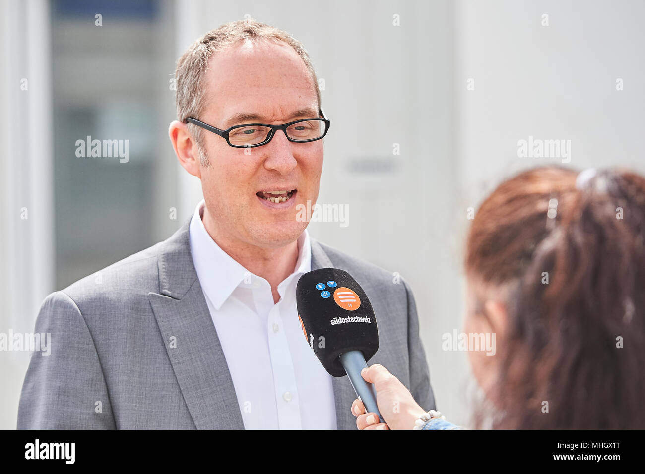 Cazis, Switzerland, 1st May 2018. Member of the Government and Head of Department of Justice Dr. Christian  Rathgeb is interviewed during the media event on the topping out of the new penal institution Realta in Cazis. Credit: Rolf Simeon/Alamy Live News Stock Photo