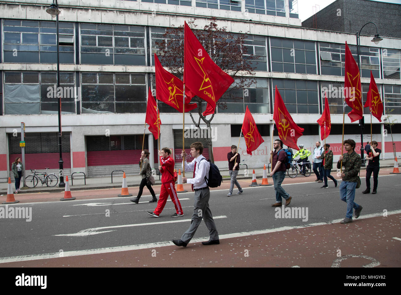 London, UK. 1st May, 2018. Communist Party of Great Britain red flags during May Day celebrations in London, England, United Kingdom. Demonstration by unions and other organisations of workers to mark the annual May Day or Labour Day. Groups from all nationalities from around the World, living in London gathered to march to a rally in central London to mark the global workers day. Credit: Michael Kemp/Alamy Live News Stock Photo