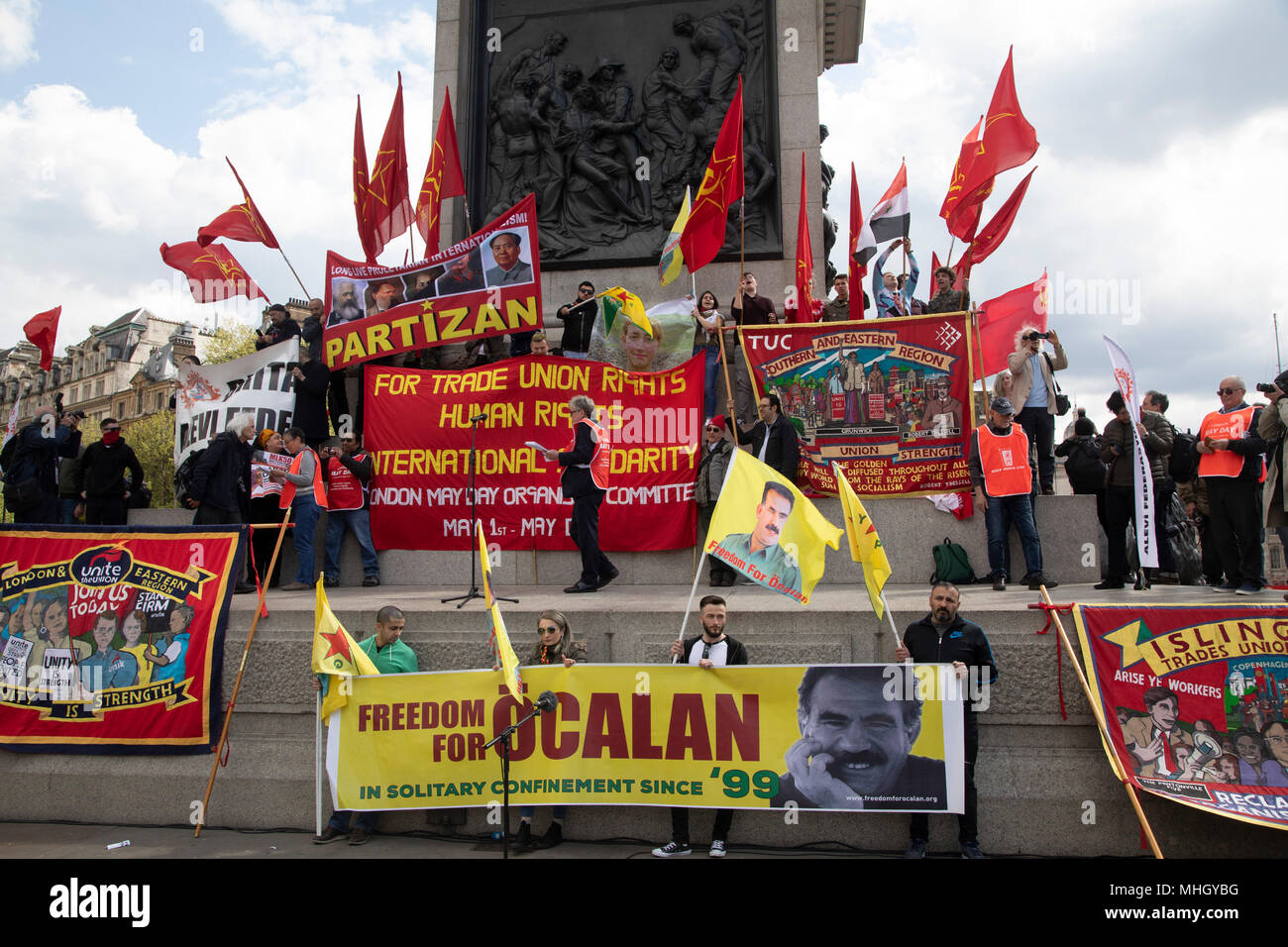 London, UK. 1st May, 2018. Communist Party of Great Britain red flags  during May Day celebrations in London, England, United Kingdom.  Demonstration by unions and other organisations of workers to mark the