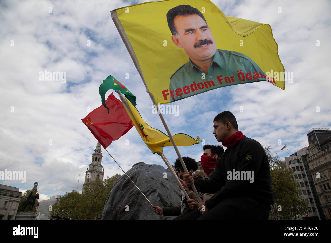 London, UK. 1st May, 2018. Freedom for Ocalan flags during May Day celebrations in London, England, United Kingdom. Demonstration by unions and other organisations of workers to mark the annual May Day or Labour Day. Groups from all nationalities from around the World, living in London gathered to march to a rally in central London to mark the global workers day.Credit: Michael Kemp/Alamy Live News Stock Photo