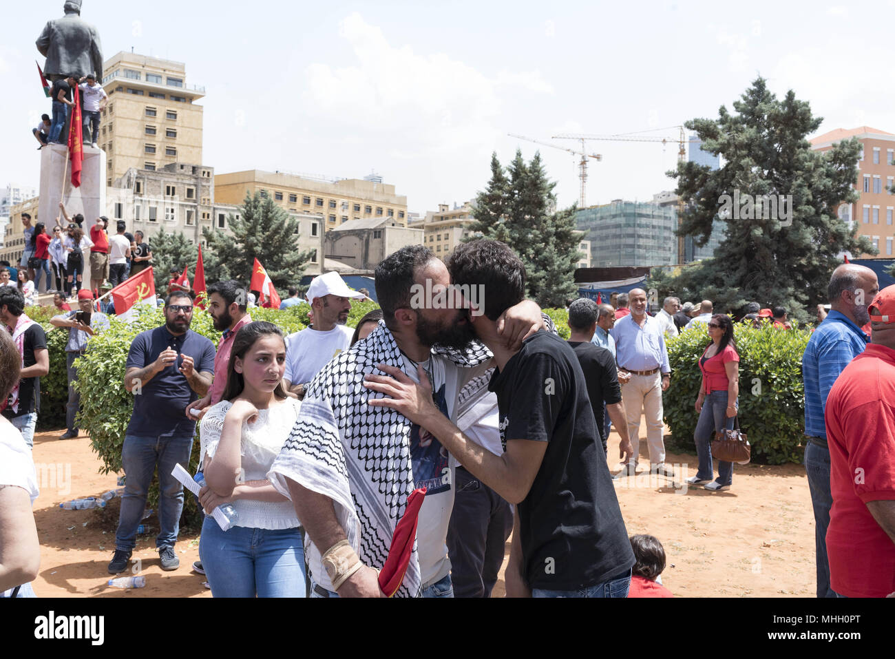 Beirut, Lebanon. 1st May, 2018. Two men embrace during a march organized by Members of the Lebanese Communist Party and other worker rights groups in celebration of International Workers' Day. Credit: Antoine Abou-Diwan/SOPA Images/ZUMA Wire/Alamy Live News Stock Photo