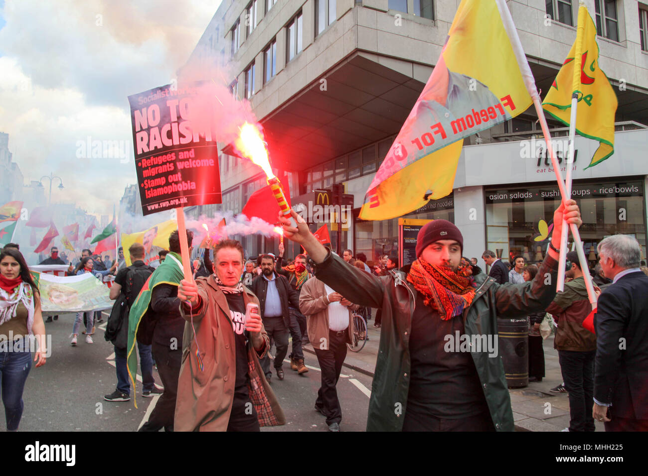 London, UK. 1st May 2018. Kurdish protesters set off Flares at Mayday Credit: Alex Cavendish/Alamy Live News Stock Photo