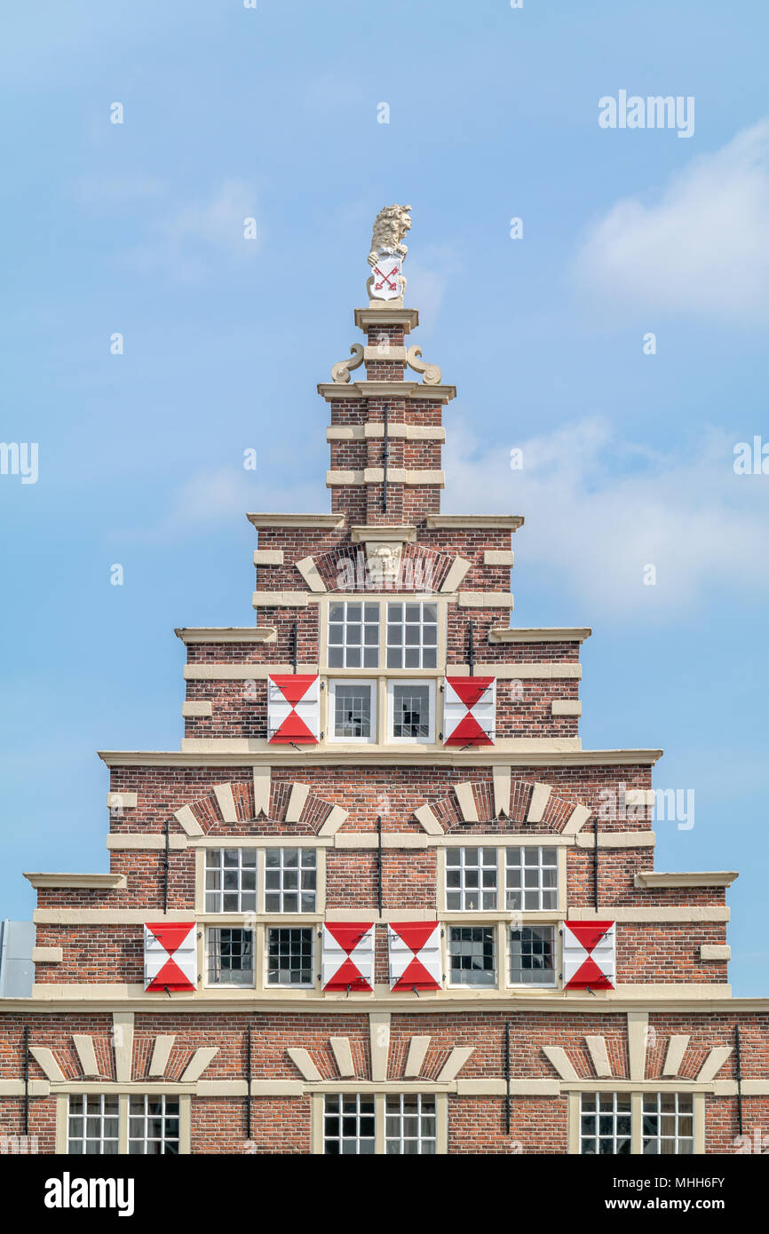 crow stepped gable roof with coat of arms on the carpenters yard in the historic centre of Leiden. Stock Photo