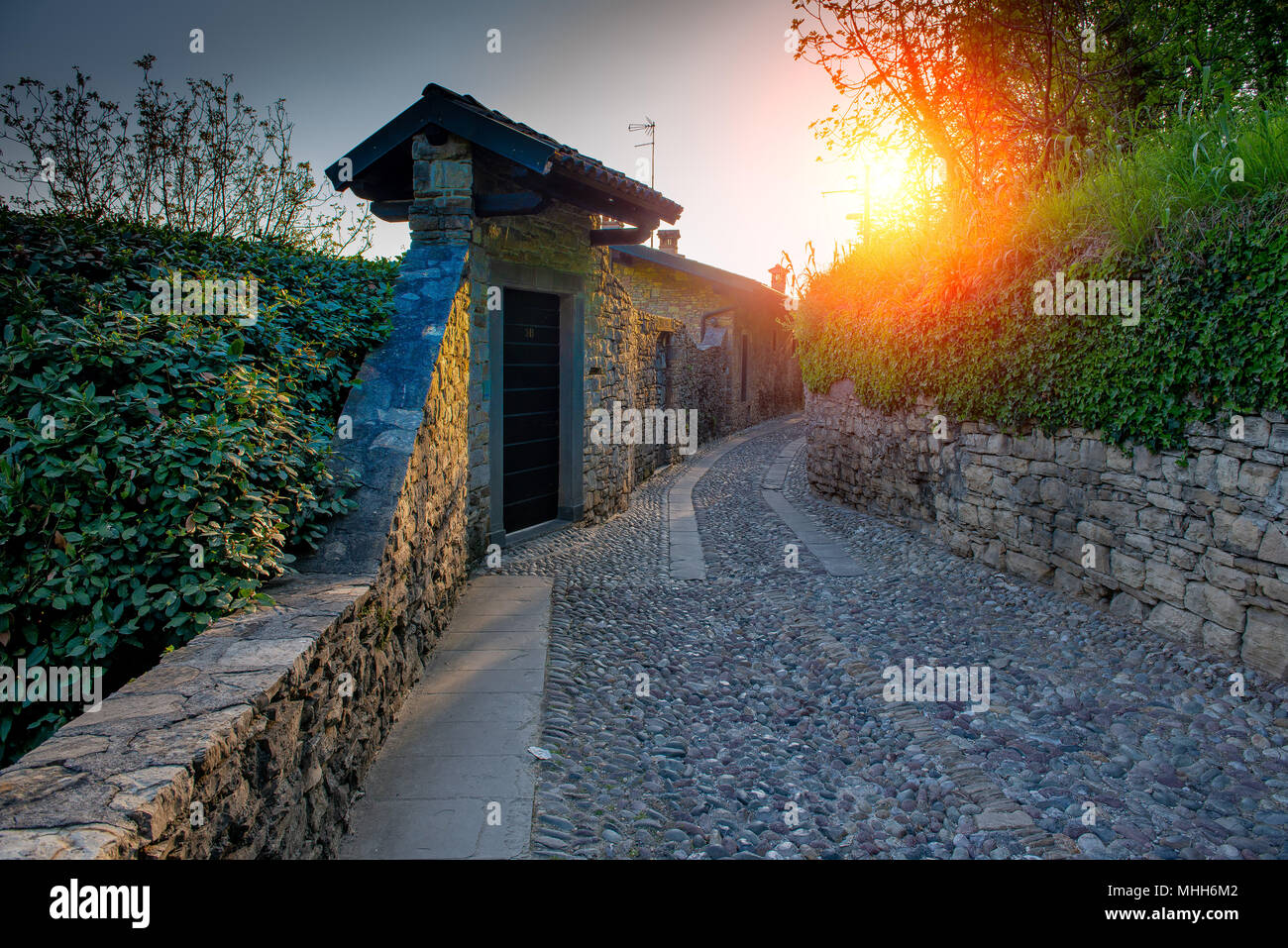 ancient road in pebbles connecting ancient city of bergamo Stock Photo