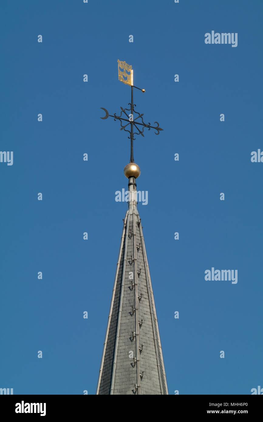 Spire with windvane and coat of arms on the tower of the protestant church in Voorschoten Stock Photo