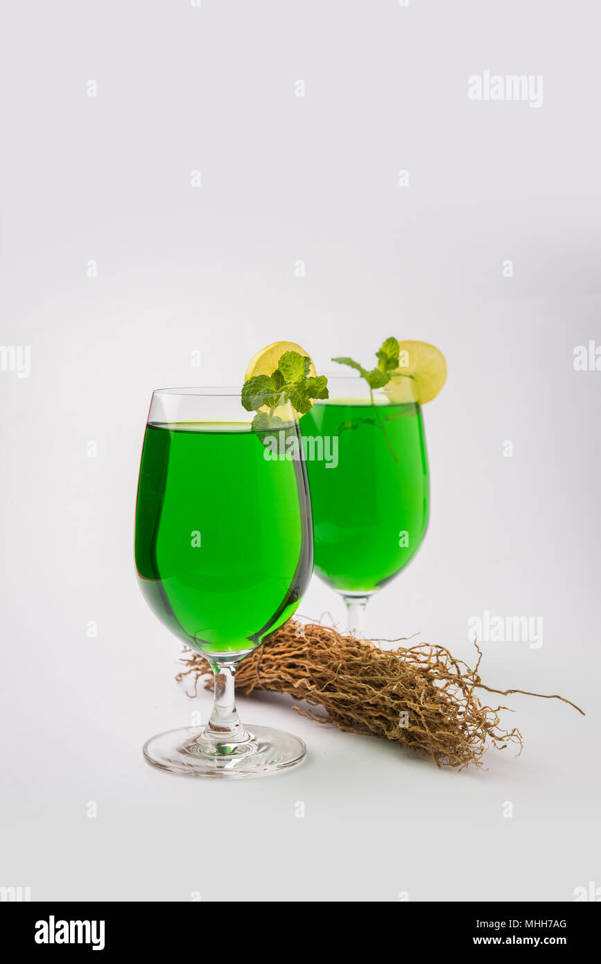 Green KHUS Sharbat or Vetiver grass extract or Chrysopogon zizanioides served in tall glass with mint leaf, popular summertime refreshing drink from I Stock Photo