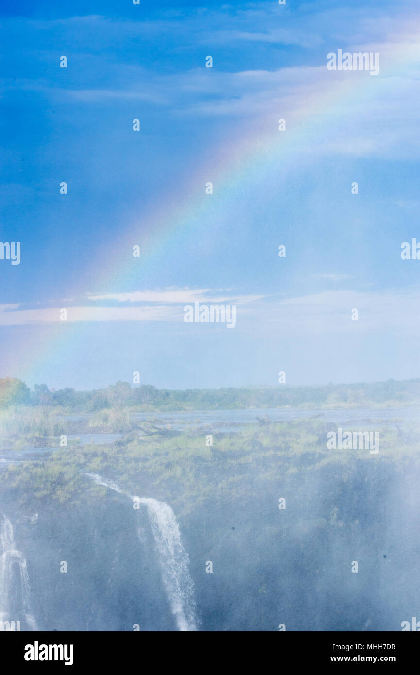 Rainbow over the Victoria Falls, Zambezi River, Zimbabwe and Zambia Stock Photo