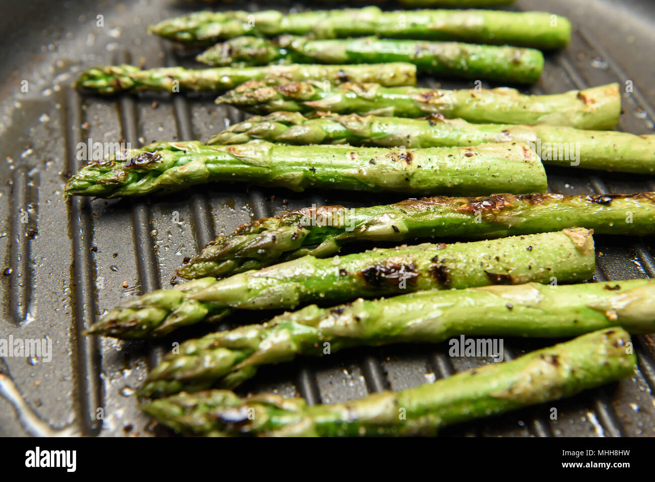 Fresh Asparagus Cooking On A Griddle Pan Stock Photo Alamy