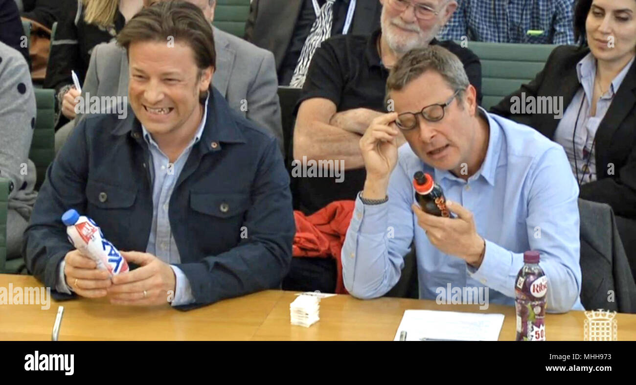 Jamie Oliver and Hugh Fearnley-Whittingstall give evidence to the Health and Social Care Committee about child obesity at Portcullis House in Westminster, London. Stock Photo