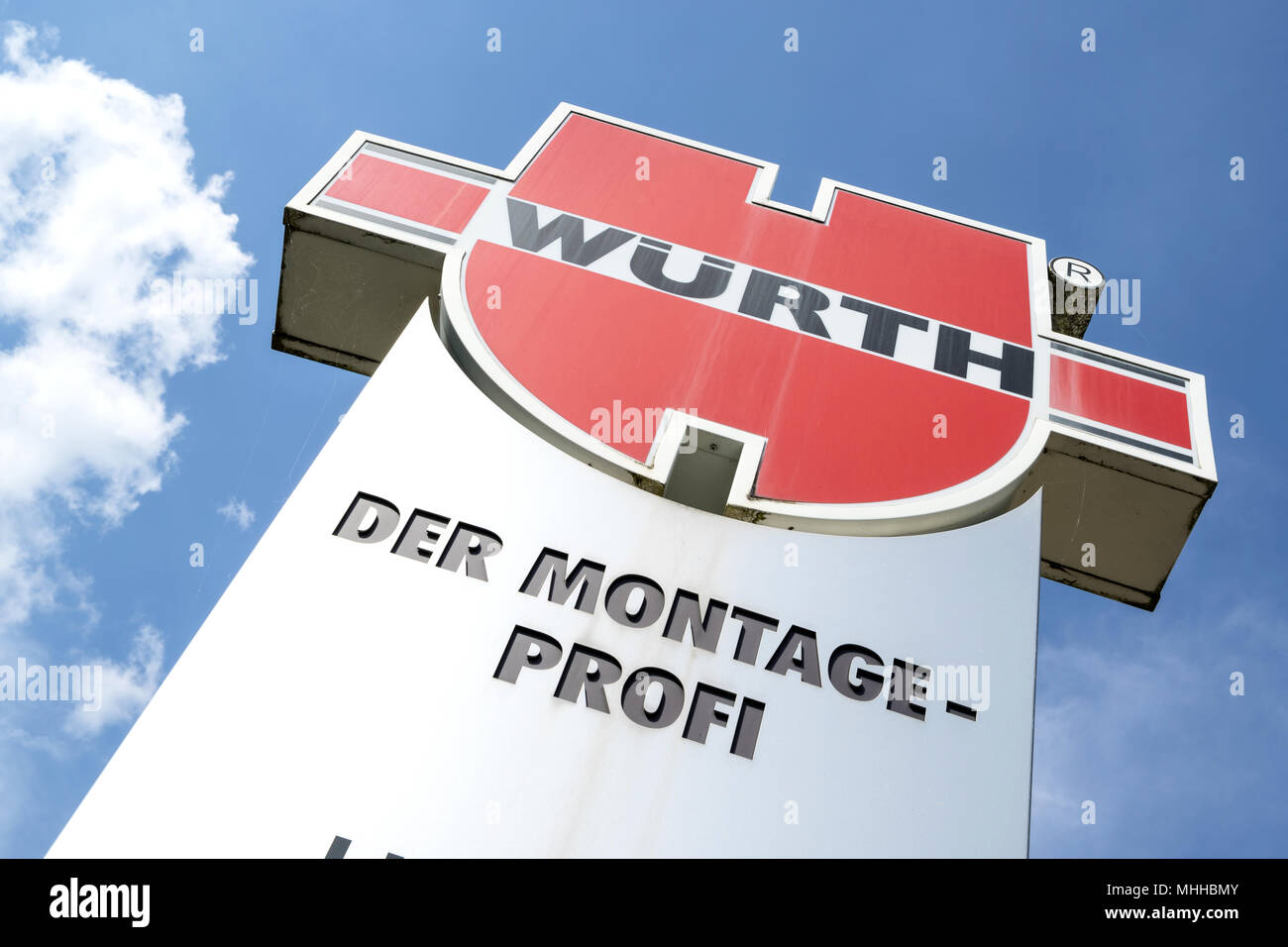 Würth sign against blue sky. The Würth Group is world market leader in the trade with connecting materials. Stock Photo