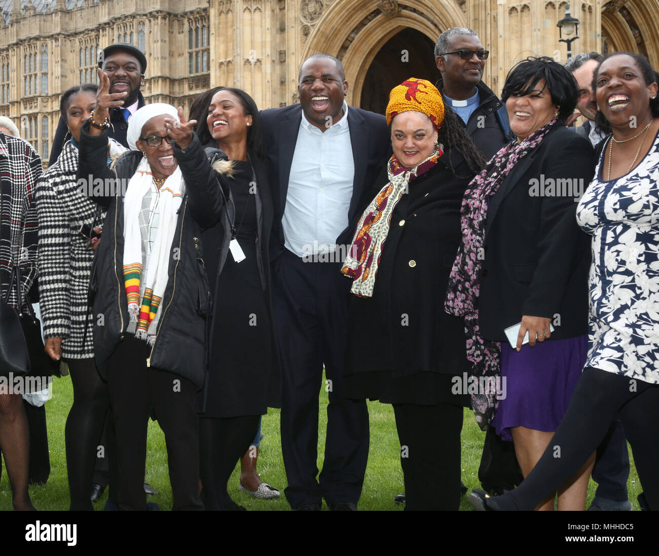 David Lammy MP (centre) with members of the Windrush generation during a photocall in Westminster, London, following a personal apology from immigration minister Caroline Nokes, as the victims visited Parliament for the