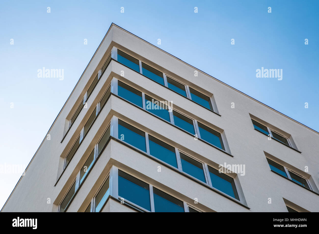 new building white on blue sky background Stock Photo - Alamy