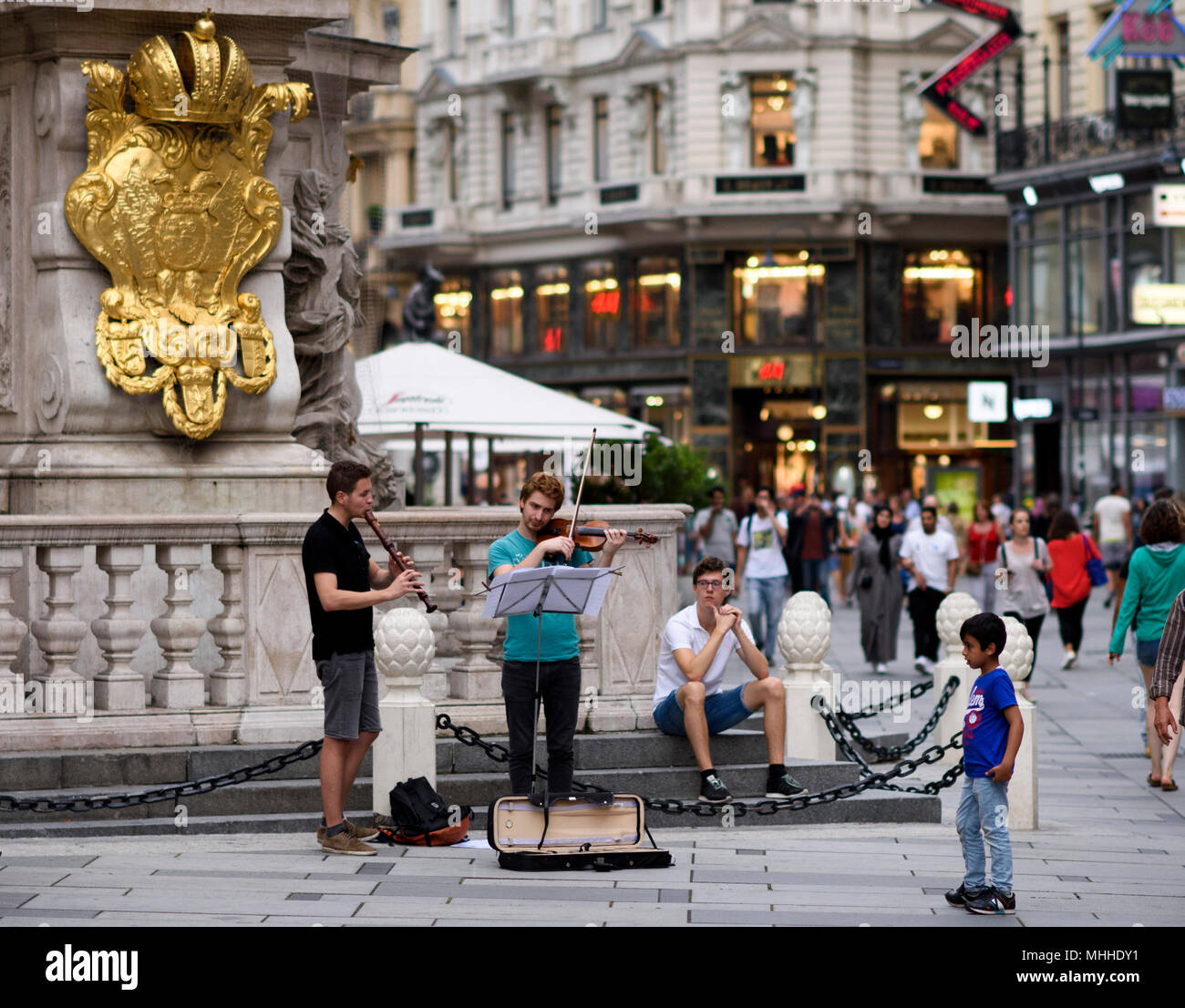 Musicians play at the Trinity column or Plague column on Graben street Vienna, Austria in the summer. Stock Photo
