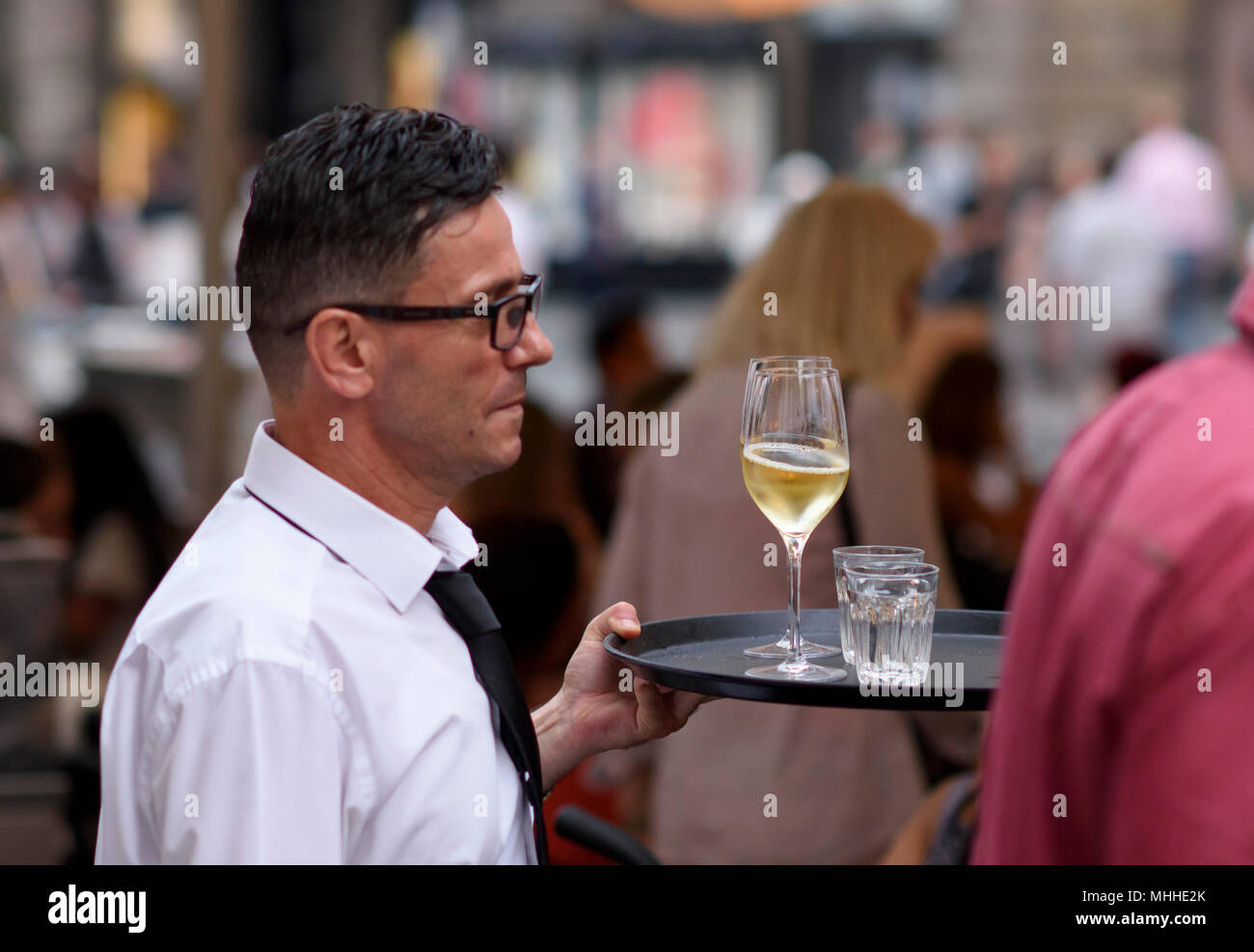 Waiter with wine on Graben street Vienna, Austria. Stock Photo