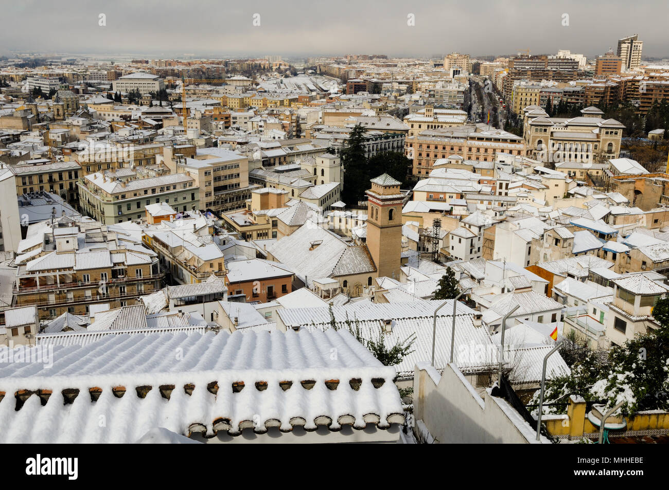Snow storm with slush on sidewalks. Granada, Andalusia, Spain Stock