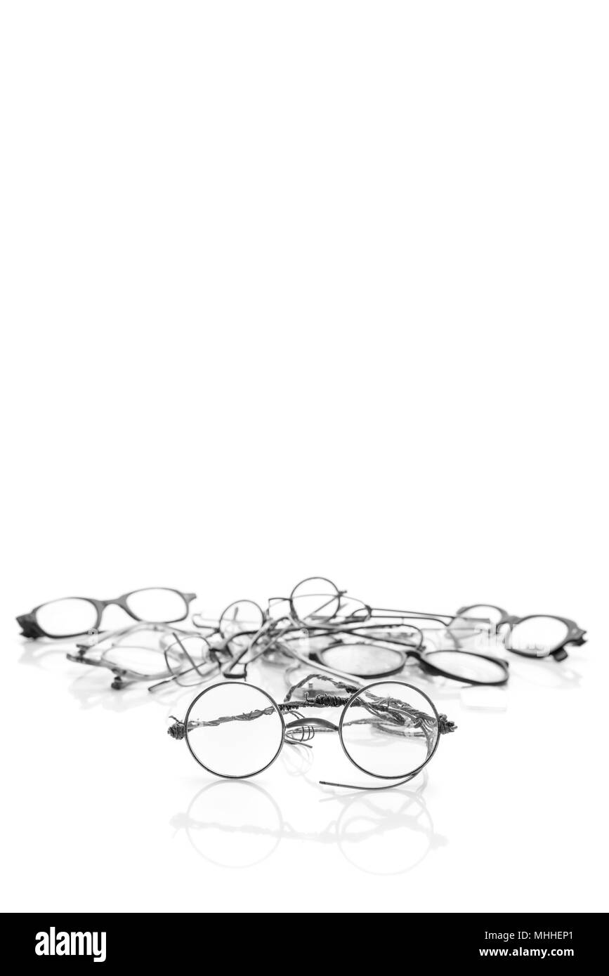 Group of old broken eyeglasses isolated on white background. Move for create place for text