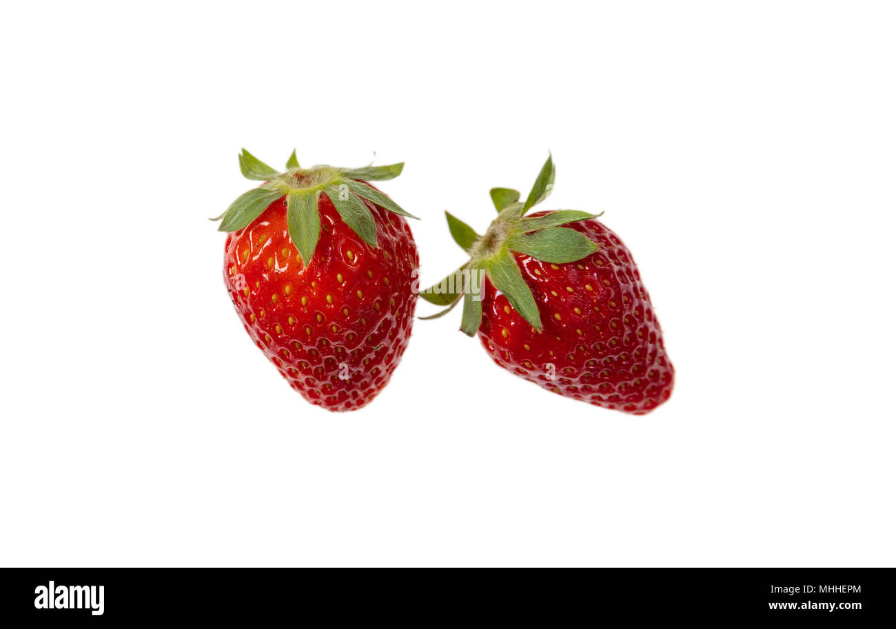 Two fresh organic strawberries isolated on white background Stock Photo ...