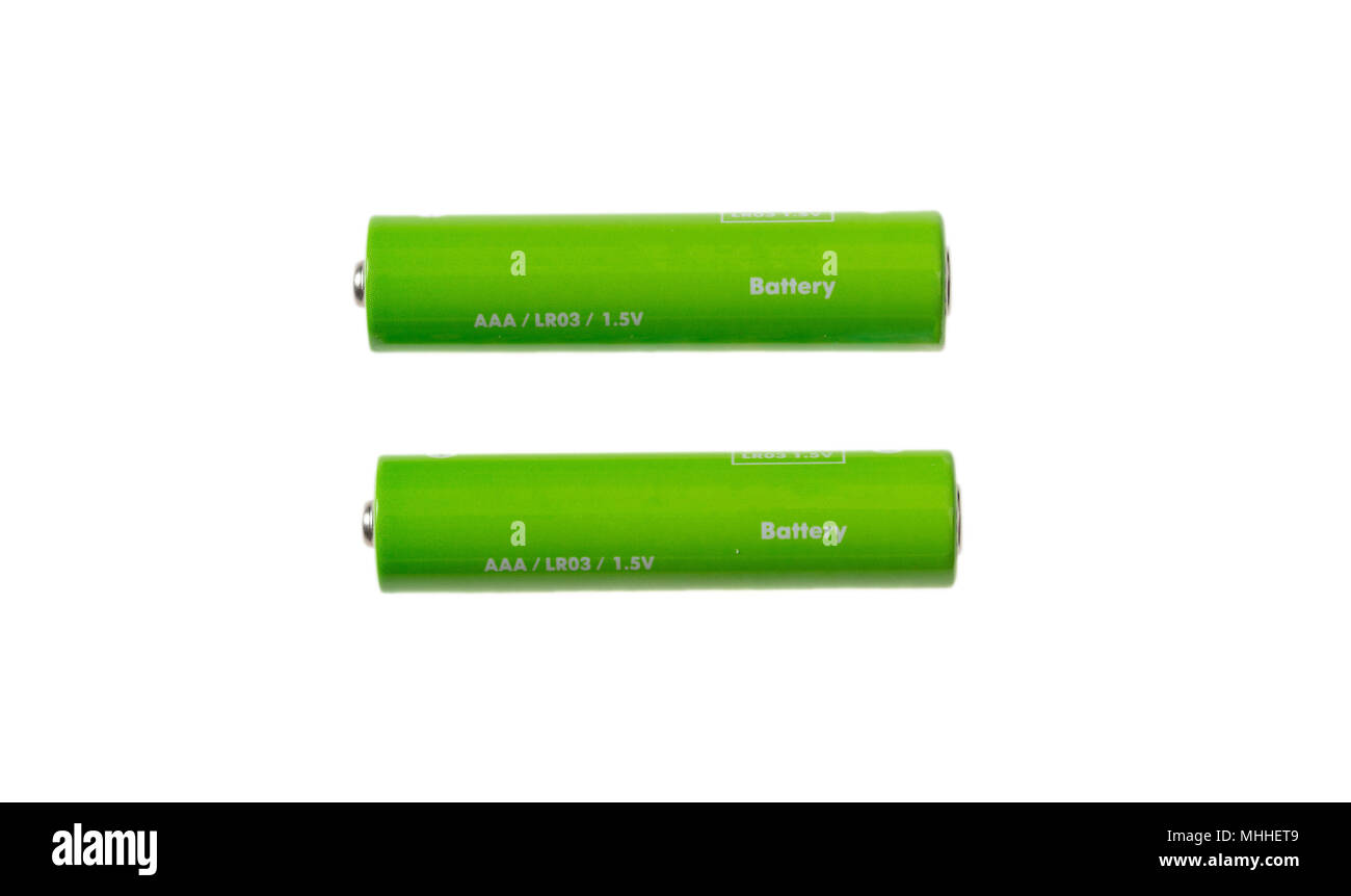 Two green alkaline batteries isolated on white background Stock Photo Alamy
