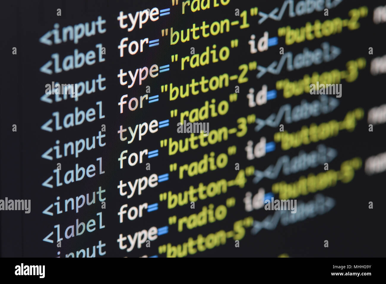 Real Html code developing screen. Programing workflow abstract algorithm concept. Lines of Html code visible. Stock Photo