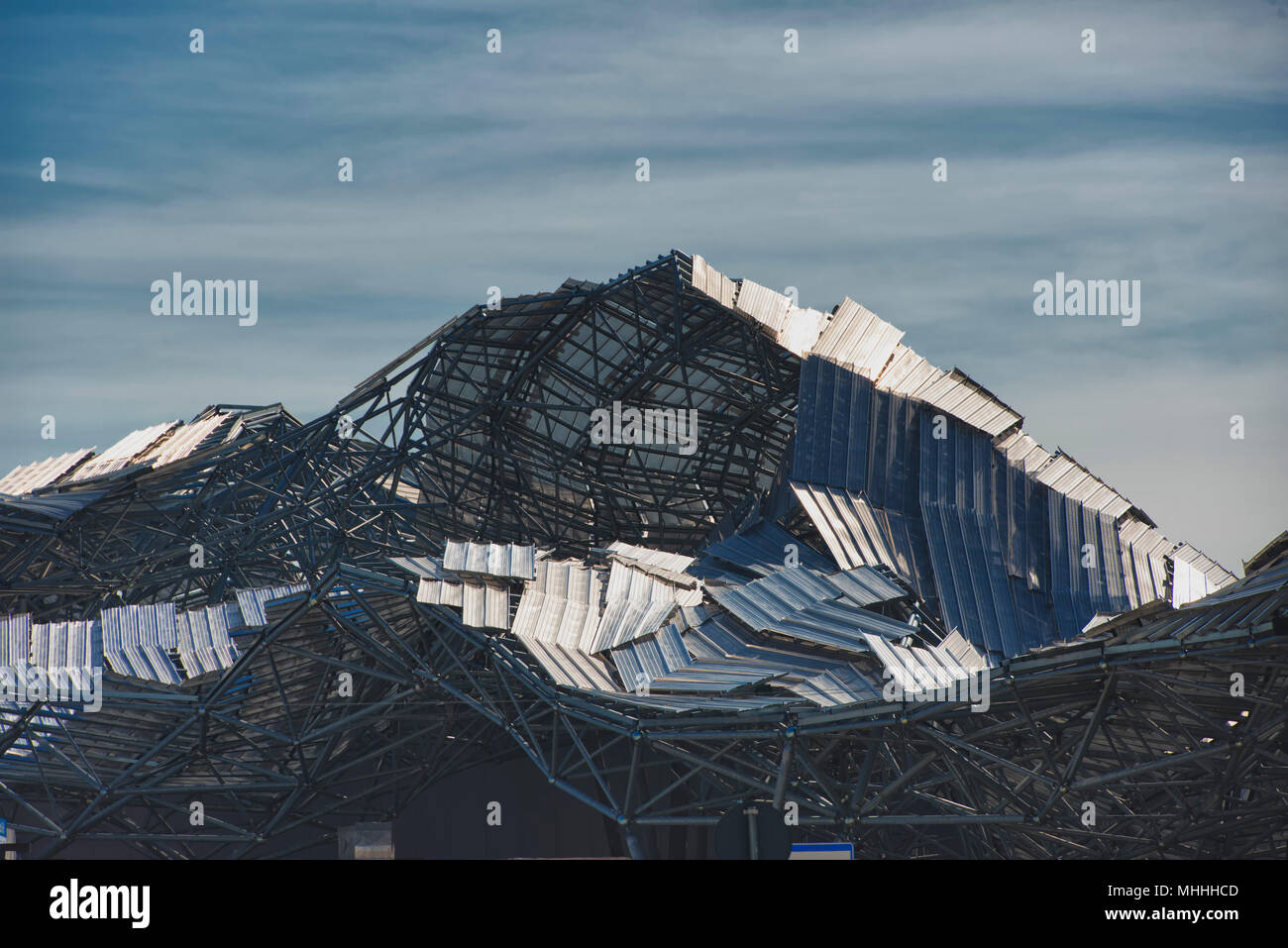 Destroyed metallic roof after hurricane Stock Photo
