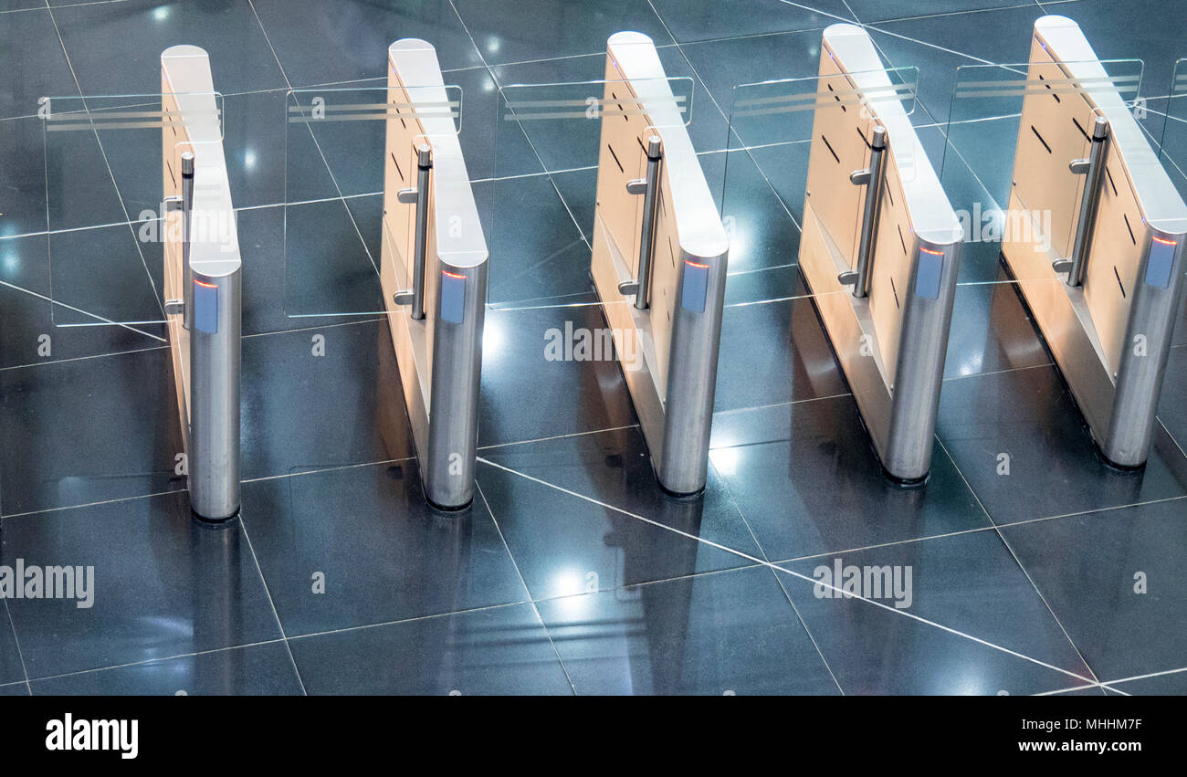 Set of modern turnstiles in  the Bitexco Financial Tower, a modern skyscraper in District 1, Ho Chi Minh City, Vietnam. Stock Photo