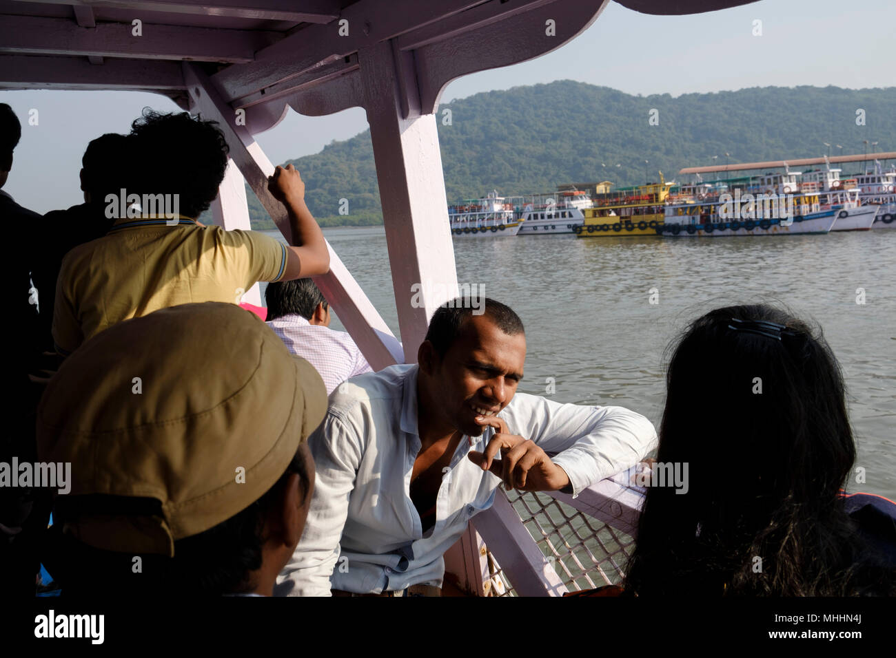 India - Mumbai - Tourists on the ferry to the Elephanta Caves on Elephanta Island. The Unesco World Heritage Site lies in the Mumbai Harbour about 7km from the mainland shore at Mumbai. Stock Photo