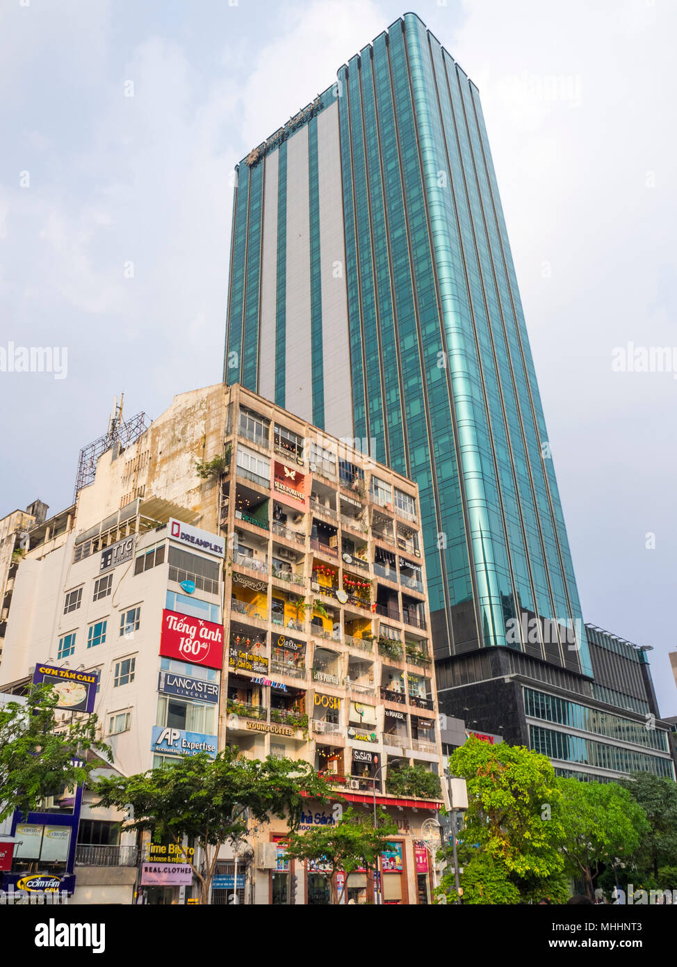 Iconic cafe apartments next door to modern hotel on Nguyen Hue Walking  street, District 1, Ho Chi Minh City, Vietnam Stock Photo - Alamy