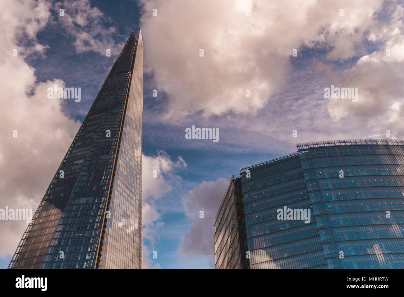 LONDON - APRIL 26, 2018: The Shard building in London with blue sky and white clouds Stock Photo