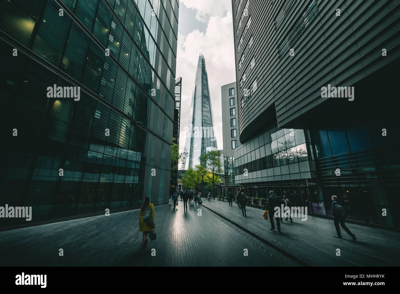 LONDON - APRIL 26, 2018: People walking towards the Shard building in London Stock Photo