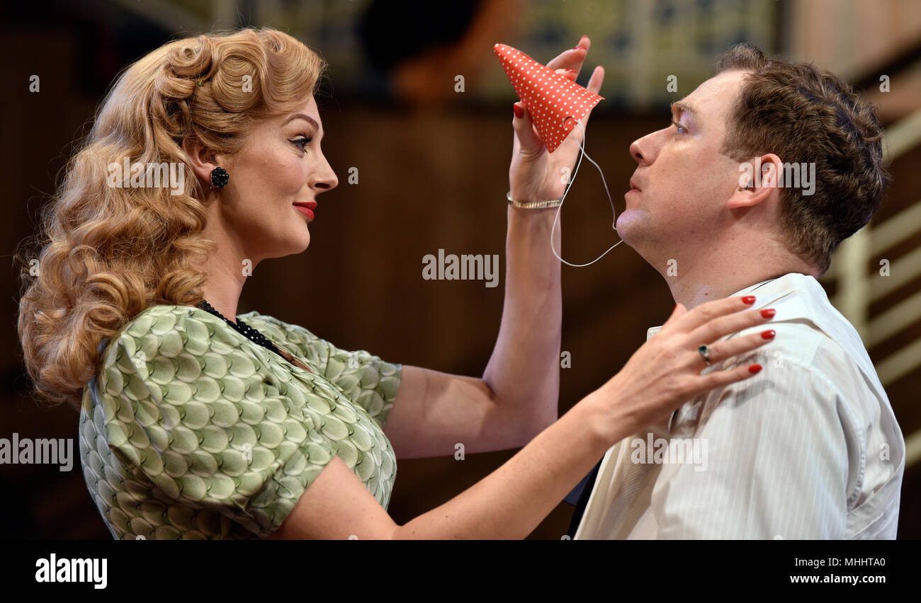 Rufus Hound (playing Garry Essendine) and Katherine Kingsley (playing Liz Essendine) in a scene from Present Laughter by Noel Coward, Chichester, UK. Stock Photo