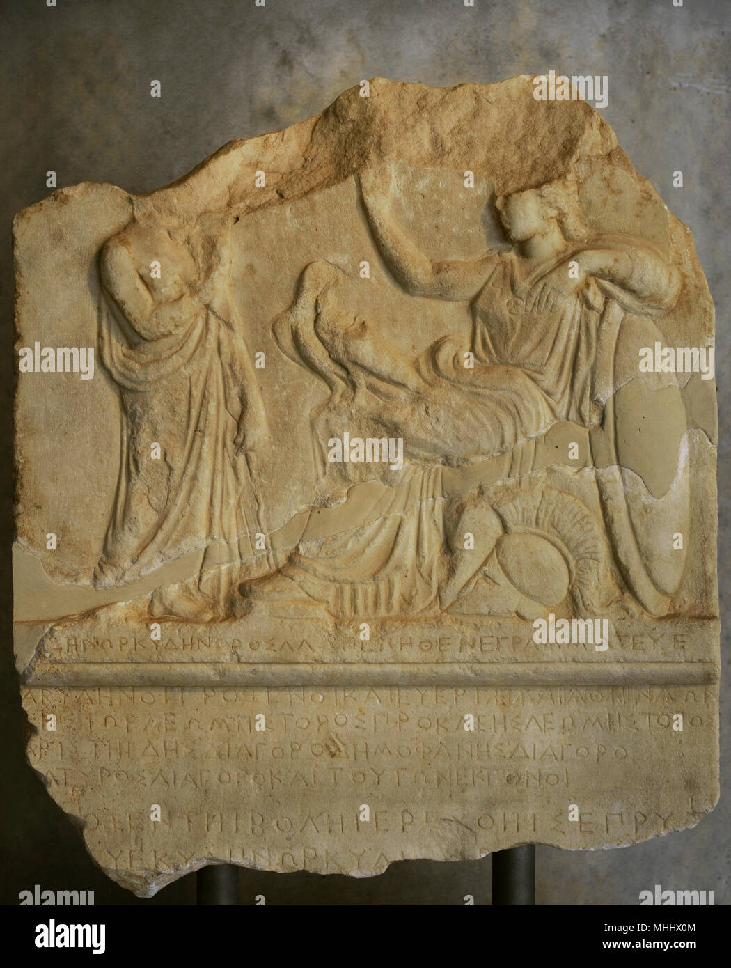 Honorary decree for the proxenoi (consul) of Abydos. The Athenians honor the proxenoi of Abydos, a city on the Asiatic coast of the Hellespont. On the relief, Athena with an eagle on her lap, a symbol of Abydos, converses with a representative of the proxenoi (consuls). First quarter of the 4th century BC. Acropolis Museum. Athens. Greece. Stock Photo