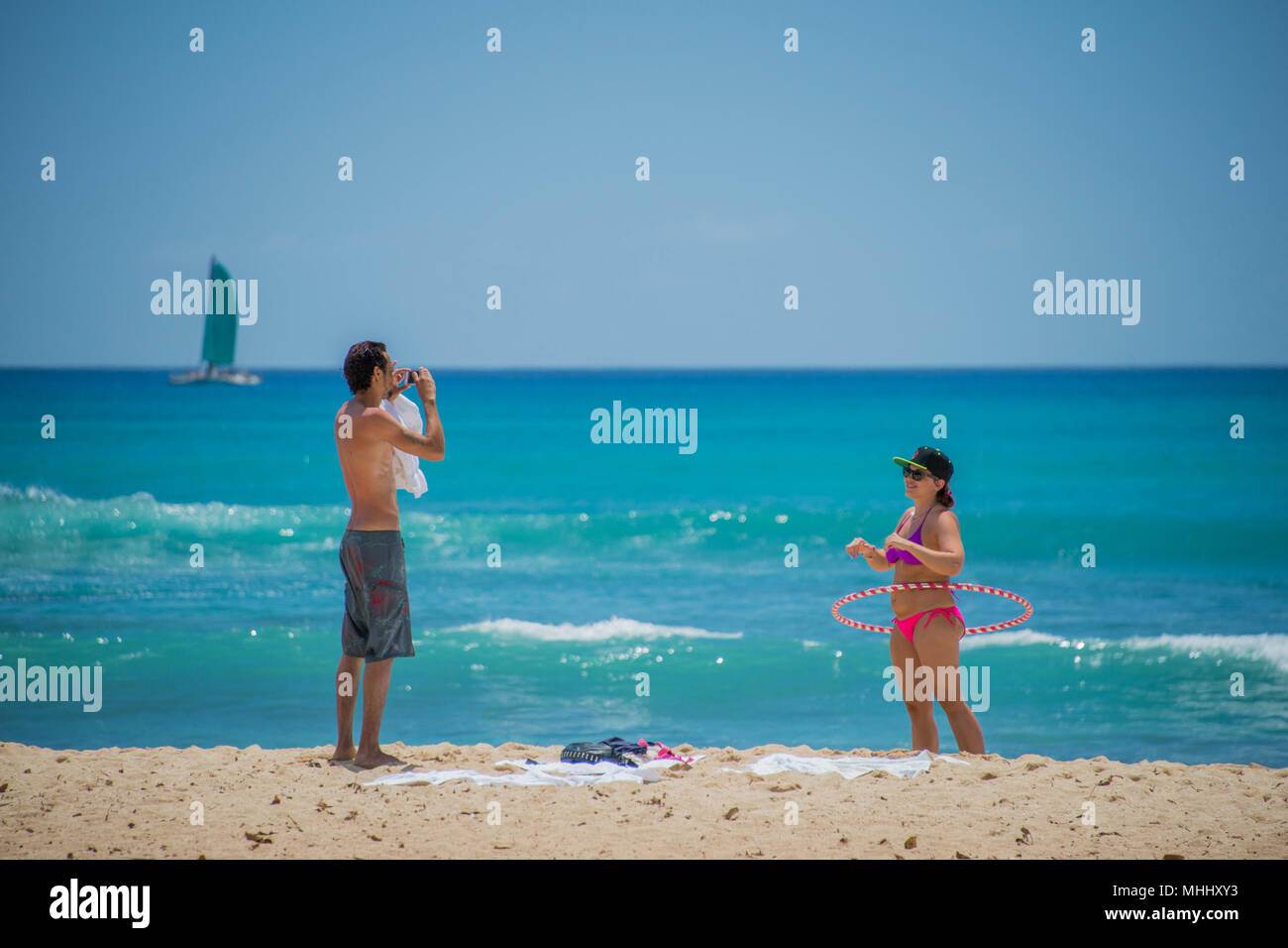 HONOLULU, USA - People having fun at waikiki beach in Hawaii Oahu island Stock Photo