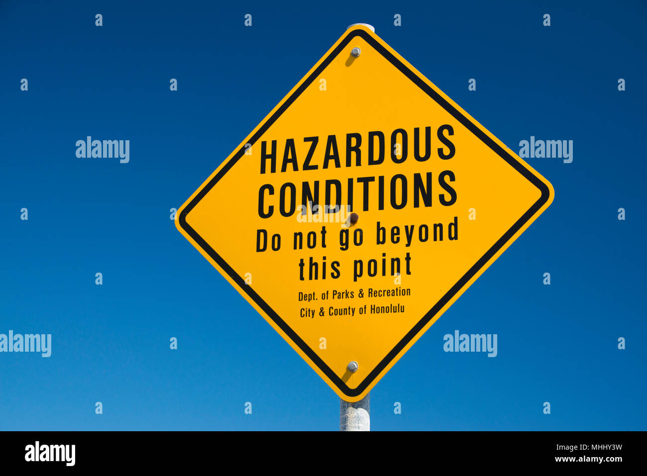 hazardous conditions danger sign in hawaii on the shore Stock Photo Alamy
