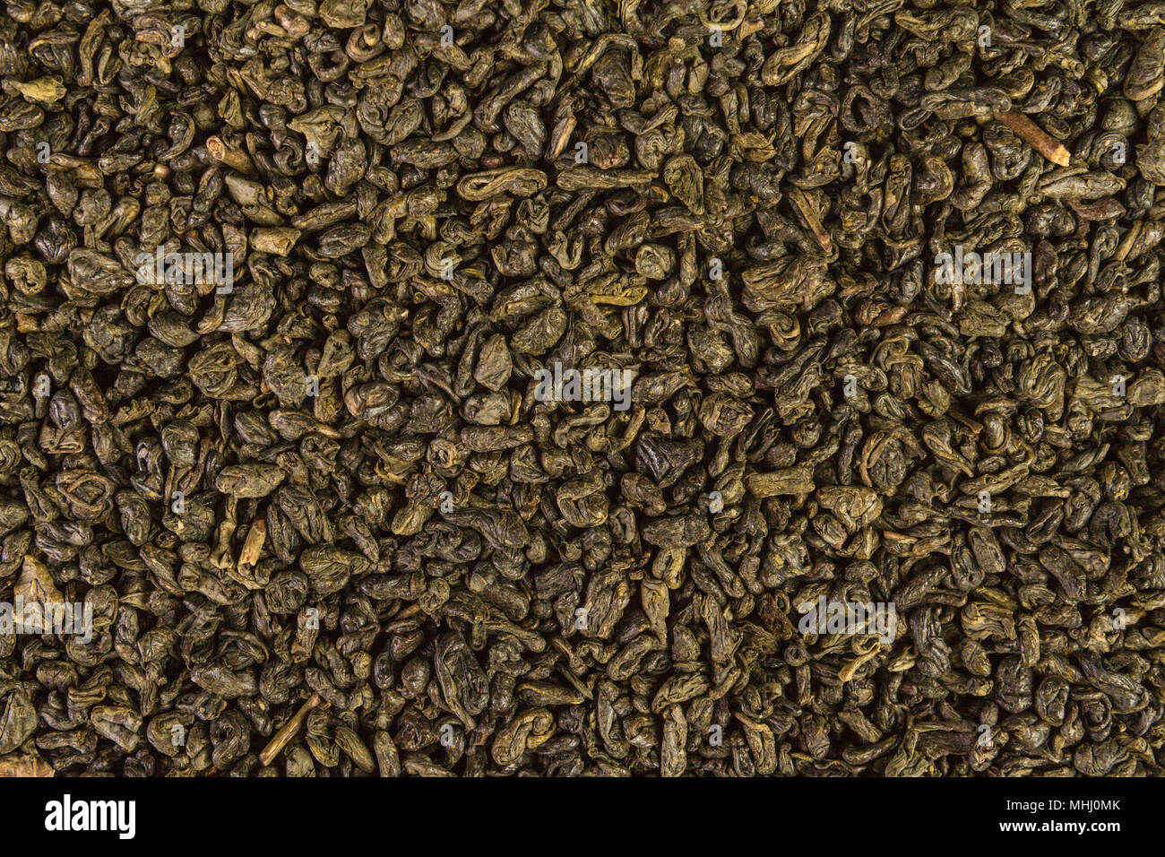 Dried leaves of green chinese gunpowder tea full frame image backgrounds Stock Photo