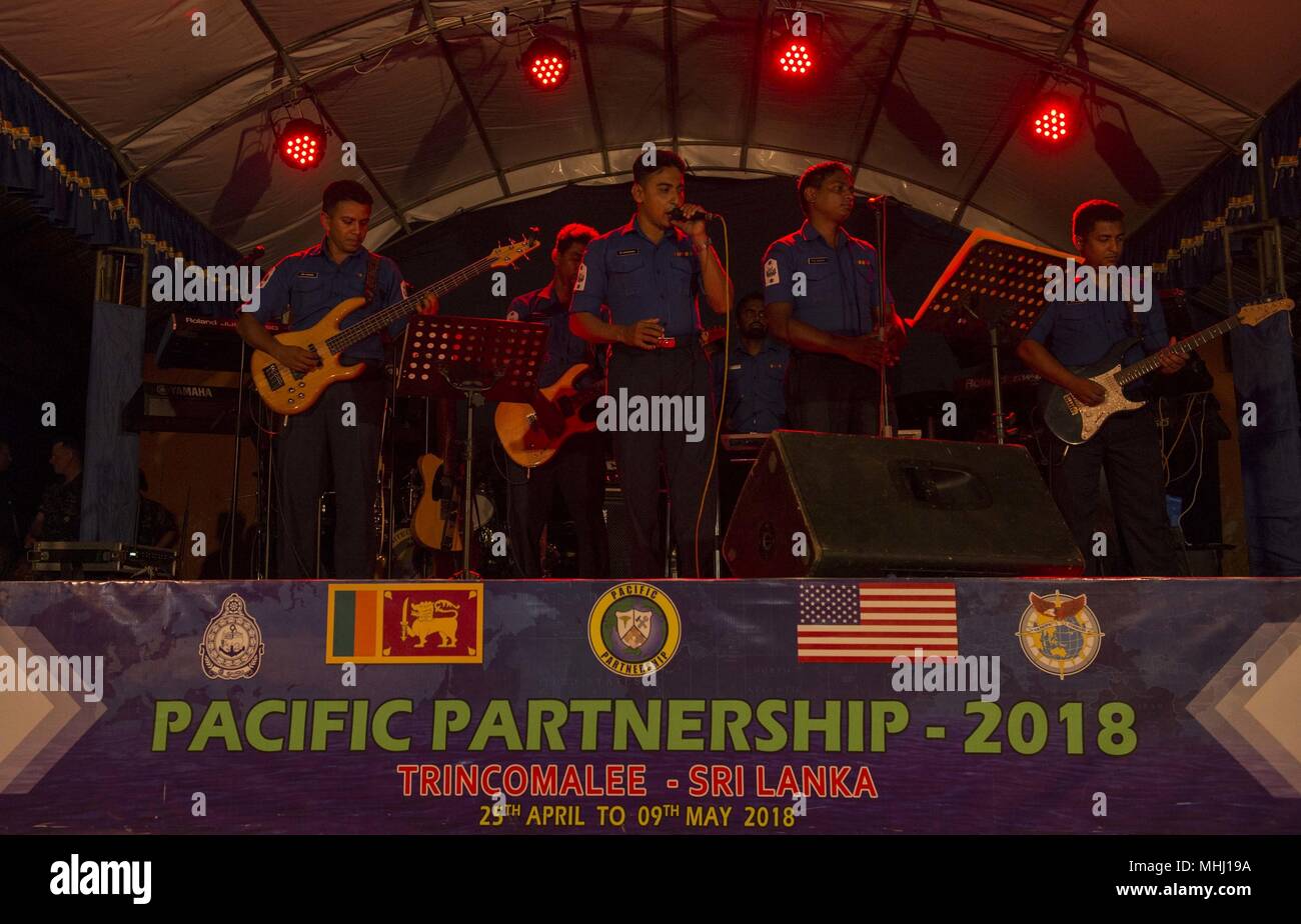 180428-N-MD713-0703 TRINCOMOLEE, Sri Lanka (April 28, 2018) Members of the Sri Lanka Navy Band perform for local Sri Lankan's, and U.S. service members at Mattur public grounds as a part of Military Sealift Command hospital ship USNS Mercy's (T-AH 19) community relations event for Pacific Partnership 2018 (PP18), April 28, 2018. PP18's mission is to work collectively with host and partner nations to enhance regional interoperability and disaster response capabilities, increase stability and security in the region, and foster new and enduring friendships across the Indo-Pacific Region. Pacific  Stock Photo