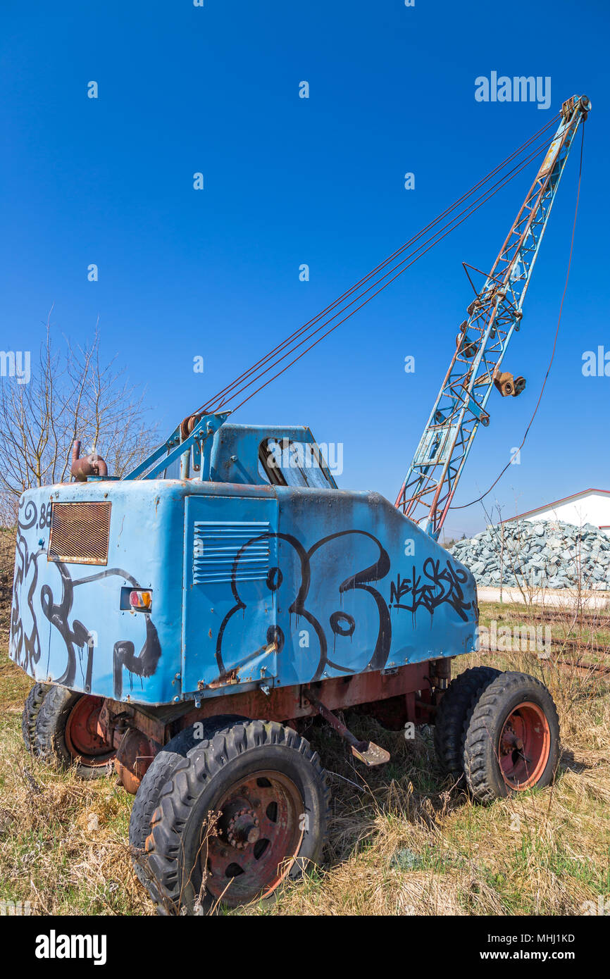 Wreck of an old scrapped excavator Stock Photo