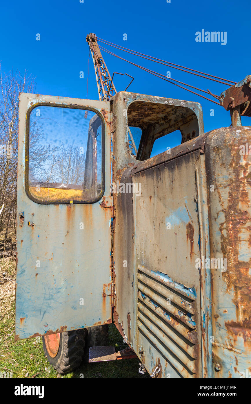 Wreck of an old scrapped excavator Stock Photo