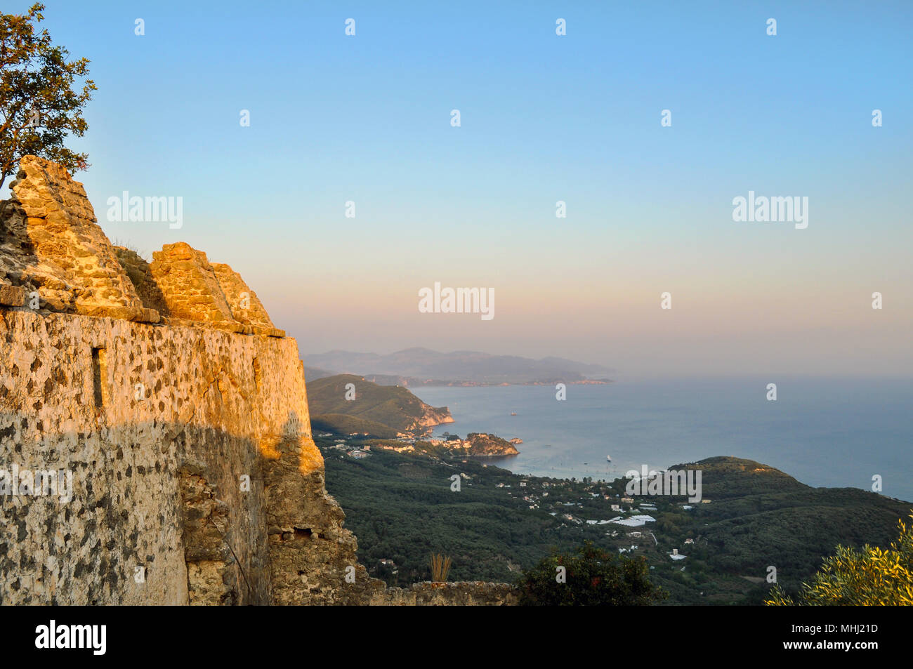 Panoramic view of the gulf of Parga town in Greece. View from the castle of Ali Pasha located above the Anthousa village. Sunset, golden hour Stock Photo