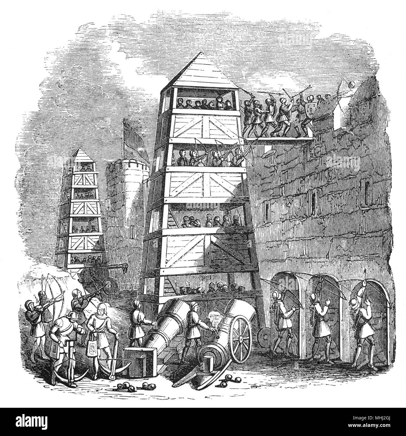 A siege tower in the 14th Century from which longbows and crossbows could be used in siege warfare. They were used along side Cannon that replaced the various types of catapults but still included a wide variety of siege engines like scaling ladders and battering rams. Stock Photo
